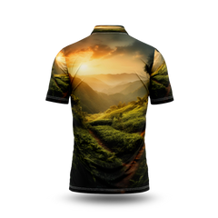 A sunset over a green mountain with a path leading to the horizon.