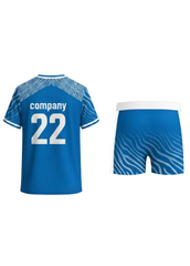 Blue custom sports jersey with white wave pattern on shoulders and matching shorts, back view design for cricket and football team uniforms in India
