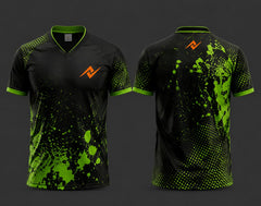 Front and back view of a black and neon green V-neck cricket jersey featuring paint-splash and halftone graphics with an orange chest logo and matching back neck logo.
