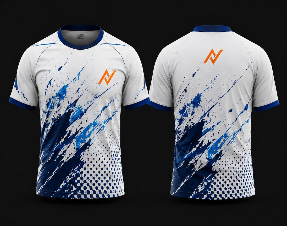 Front and back view of a white and royal blue round neck cricket jersey featuring bold blue paint splash graphics, halftone detailing, and orange chest and back logos.