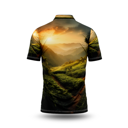 A sunset over a green mountain with a path leading to the horizon.