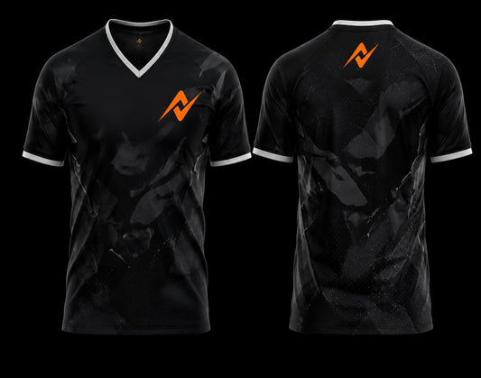Front and back view of a black and graphite V-neck esports jersey featuring subtle camouflage graphics with an orange logo on the chest and below the back neckline.