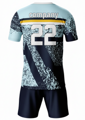 Custom light blue and navy sports jersey with abstract textured graphic pattern and matching shorts for cricket, football and team sports by NextPrint India