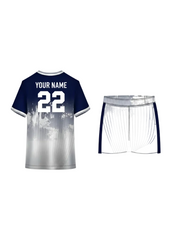 Navy blue and white gradient sports jersey with abstract paint splash design and matching shorts for cricket, football and team uniforms in India