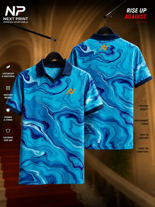 Next Print Aqua Marble polo collar V-neck cricket jersey featuring turquoise, navy blue, and white marble-inspired graphics displayed in front and back views.