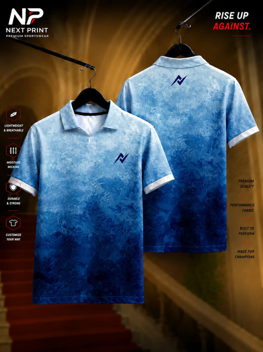 Front and back view of Next Print glacier blue gradient polo collar sports jersey featuring a textured marble pattern on breathable dry-fit fabric.
