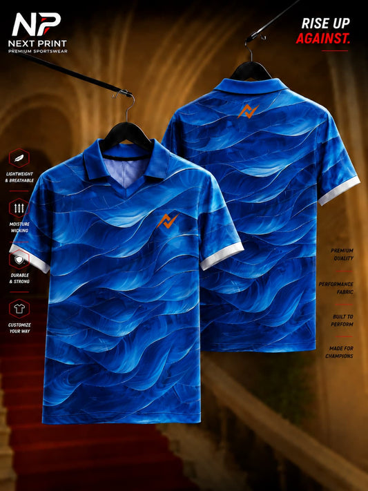 Front and back view of Next Print ocean wave blue polo collar sports jersey featuring layered wave graphics and premium dry-fit fabric.