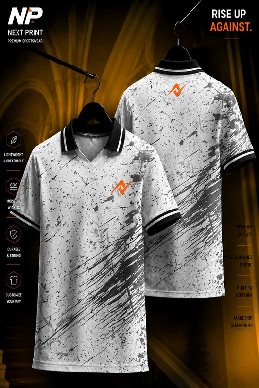 Front and back view of a white polo sports jersey featuring charcoal paint splash graphics, black collar, and premium dry-fit performance fabric.